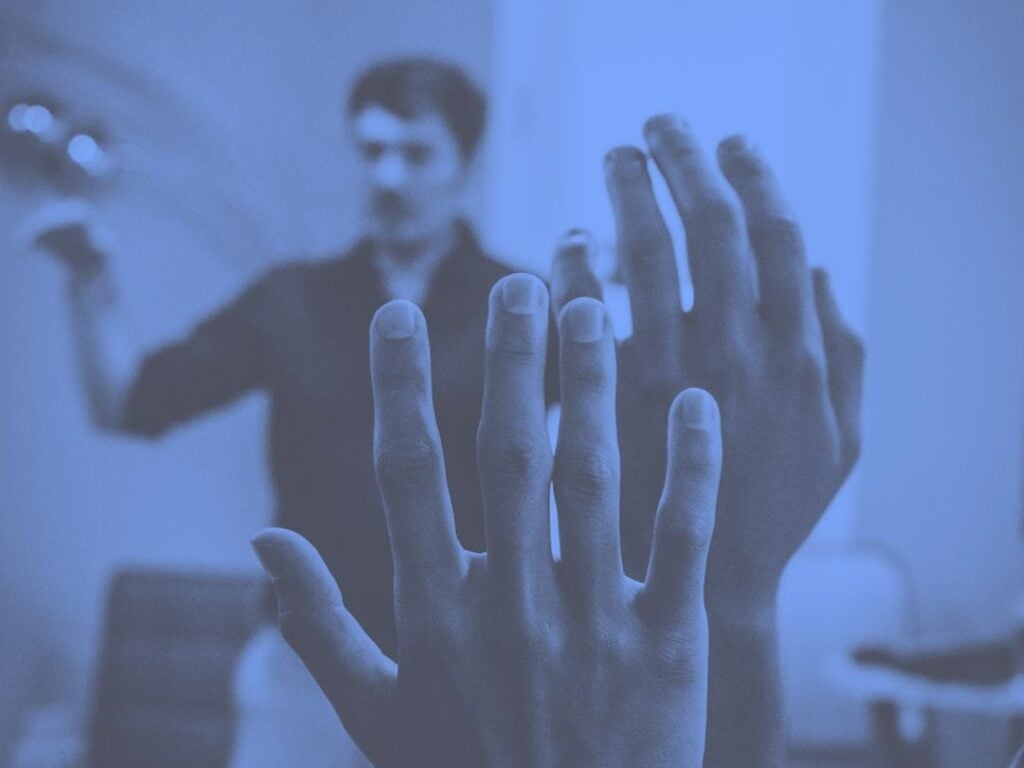 Audience raising hands as metaphor of proposal professionals asking clarification questions in a RFP-Proposal process